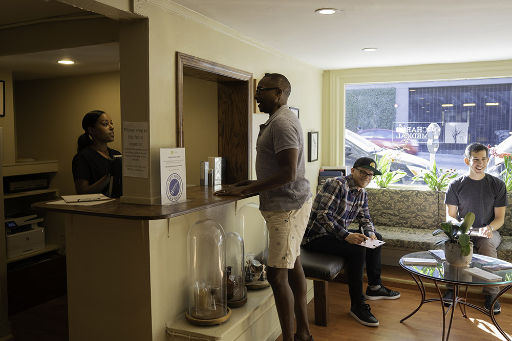 men in the waiting area and at the service counter.