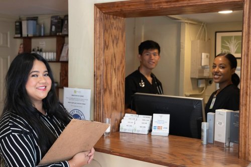staff members at the front desk