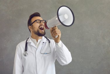 doctor holds megaphone.