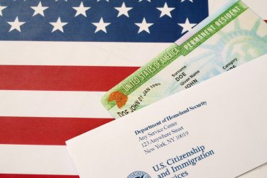 the United States flag, a green card, and USCIS letter.