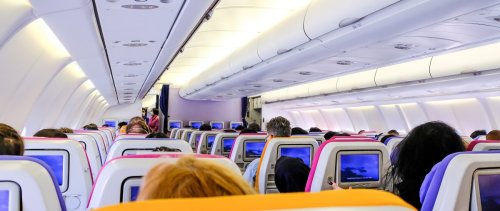 airplane cabin with passengers.