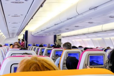 airplane cabin with passengers.