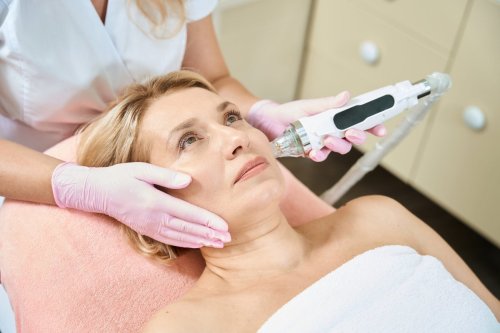 medical provider performs microneedling on patient.